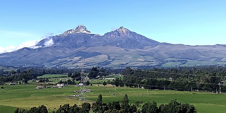 View of the Illinizas on the way to Quilotoa Lake with your private driver.